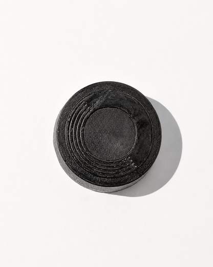O.R.G Skincare Detox Body Bar is a hand-poured exfoliating body cleanser made with bamboo charcoal, volcanic pumice, and lemongrass oil to cleanse away daily grime while physically exfoliating dry, rough surface buildup.
