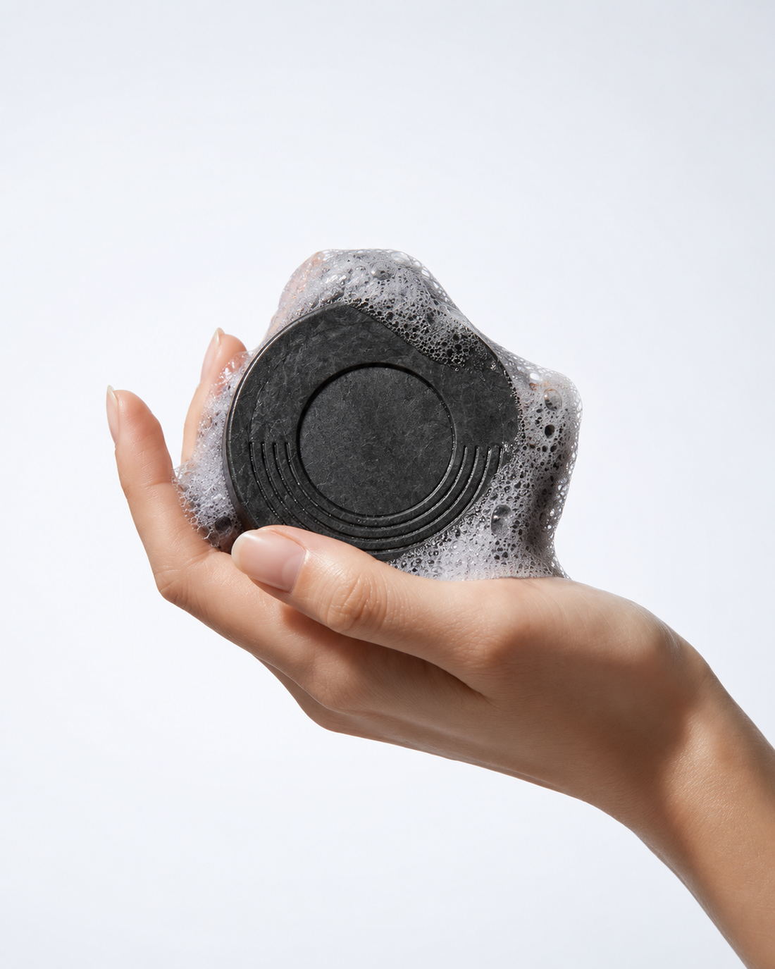 The O.R.G Detox Body Bar combines everyday cleansing with physical body exfoliation, making it easy to target rough, dry, and buildup-prone areas while you shower.
As you work the bar across wet skin, volcanic pumice gently buffs away dead surface skin while bamboo charcoal helps cleanse away oil, dirt, and impurities.

